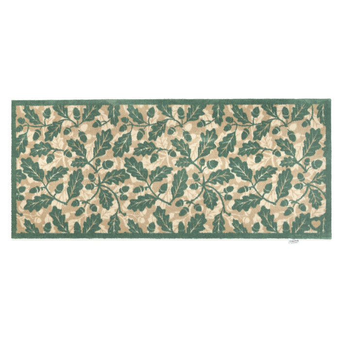 Discover the Royal Oak Washable Runner- a 100% recycled cotton runner featuring pattern of green oak leaves.